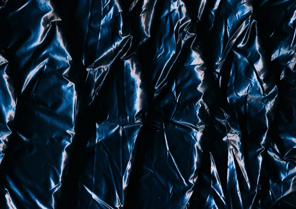 折皱的纹理 摘要背景 Grunge效应 浅光辉光阴影下黑色塑料盖的擦拭表面 — 图库照片
