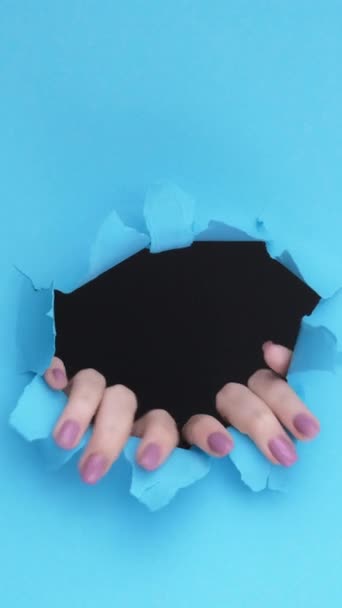 Vertical Video Breakthrough Paper Hands Hole Curious Female Fingers Touching — Stock Video