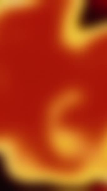 垂直ビデオ 色の輝き 背景が気になる 熱い流体だ 赤黄色のスペクトルをぼかす光フレアの動きコピースペースで滑らかな抽象的なテクスチャ — ストック動画