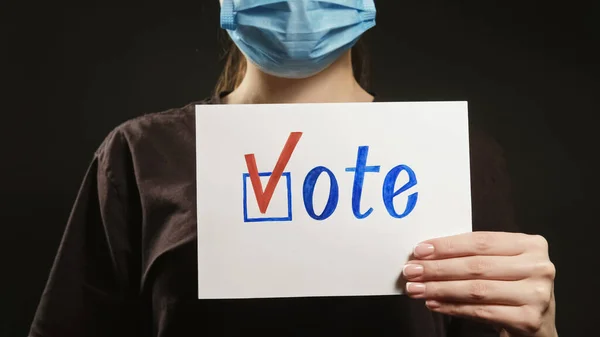 Vote Sign Pandemic Election Unrecognizable Woman Face Mask Showing Bulletin — Stock Photo, Image