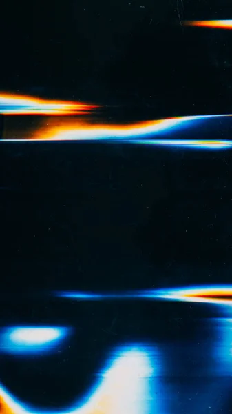 Abstract background. Glitch light. Overlay pattern. Dark black display with glowing blue orange smearing spots and lines.