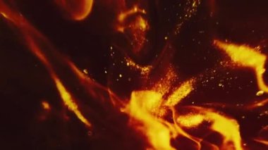 Dikey video. Soyut arkaplan oluşturuluyor. Ateş alevleri. Altın parıltılı, kırmızı, pırıl pırıl parlayan, siyah dinamik hipnotik sanatta odaklanmış, bulanık, sıcak duman..
