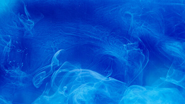 Color smoke background. Magic cloud. Blue glitter vapor hypnotic mysterious burst illusion abstract explosion fume mix spread creative fantasy art.