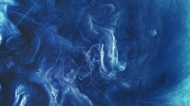 Glitter paint splash. Color smoke cloud. Explosion blast. Blue glowing shiny ink mix motion revealing abstract art background.