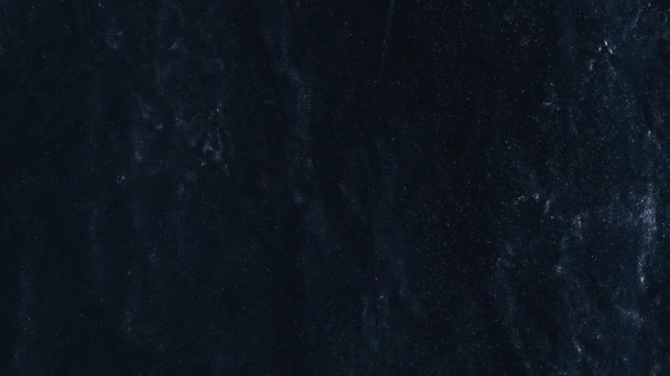 グリッターの背景 インク水 ナイトスカイ ギャラクシー スターダスト ダークブルーの荒い粒子浮遊テクスチャ抽象的な表面 — ストック動画