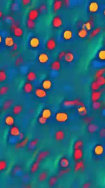 Dikey video. Görüntü kıvılcımları. Bokeh ışığı. Odaklanmamış turuncu kırmızı daireler mavi soyut arkaplanda rastgele kaotik hareketler.