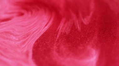 Işıl ışıl parlıyor. Işıldayan sıvı. Odaklanmamış kırmızı emülsiyon girdap dalgaları pembe karışık yaratıcı soyut sanat arkaplan dokusu.