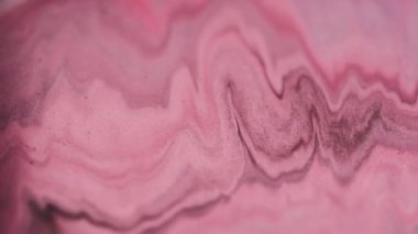 Mürekkep emülsiyonu. Odaklanmamış sim. Pembe renkli sis hareketi. Renkli pigment kum akışı dokusu soyut sıvı sanat arka planı hipnotik.