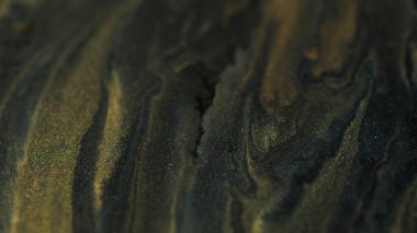 Parlak parlak boya. Mürekkep arkaplanı. Işıl ışıl sıvı jel akrilik altın parıldayan siyah karışım mistik soyut doku.