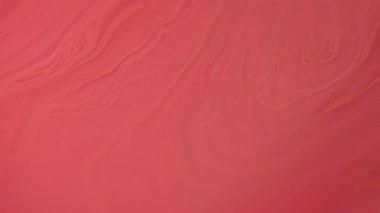 Mercan mürekkebi. Boya dökülmüş. Odaklanmamış kırmızı turuncu renk yağ emülsiyonu parlak sıvı ışık parçacıkları jel dokusu hareket soyut sanat arkaplanı.