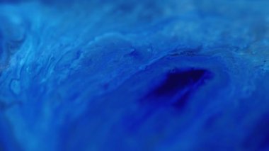 Boya dalgası. Akrilik sıvı. Odaklanmamış mavi renk emülsiyonu sıvı sıçrama karışımı akış tahıl dokusu soyut sanat arkaplanı.