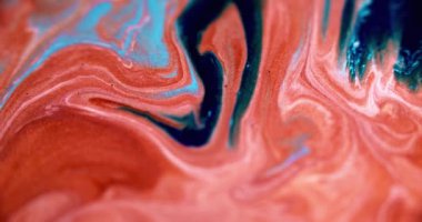 Parlak mürekkep karışımı. Akrilik sim akışı. Odaklanmamış kırmızı mavi renk parıldayan parçacıklar mermer desen boya soyut sanat arkaplan dökülmesi.