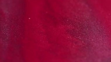Parlak akış. Parlak emülsiyon. Soyut arkaplan kırmızı renk karışımı ışıltı parçacıkları dalga aydınlatıcı sıvı yaratıcı doku sanat akışkan hareketi.
