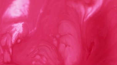 Mürekkep karışımı. Boya sıçraması. Odaklanmamış parlak kırmızı beyaz renk kabarcıkları dokusu sıvı emülsiyon akışı soyut sanat arka planı.