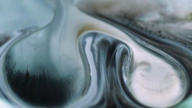 Yağ damlası. Kabarcık boyası dökülmüş. Odaklanmamış mavi siyah beyaz renk parçacıkları desen mürekkep emülsiyon akışı hareket soyut sanat arkaplanı.