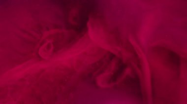 Renk sisi. Suyu boya. Pembe mürekkep kirli duman sihirli sıvı akış parıldayan parçacıklar sanatsal sis boya pigmenti soyut arkaplan.