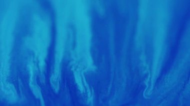 Yağ damlaları. Işıl ışıl. Parlak desenli. Odaklanmamış mavi renk parıldayan boya karışımı dalga hareketinin soyut sanat arkaplanı.