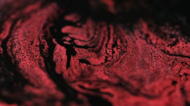 Wet shimmering texture. Paint move. Defocused red black color shimmering assortments acrylic ink water marble blend wave abstract art background. clipart