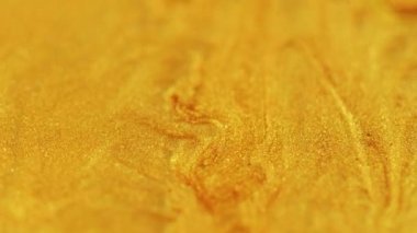 Parıldayan sıvı dalga. Pırıl pırıl. Bulanık altın sarısı, parıldayan parçacıklar şeffaf sıvı akış hareketi soyut sanat arkaplanı.