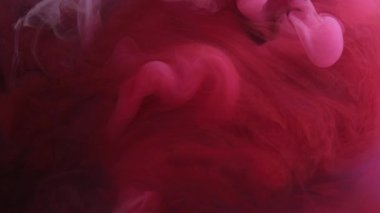 Boya sıvısı. Su altında sıçrama. Renkli sis bulutu. Soyut arkaplanda canlı kırmızı mor parıldayan patlama buhar dalgası sanat dokusu.
