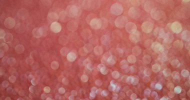 Bulanık konfeti. Şeftali pırıltısı. Açık renklerin dekoratif ışıltısı. Mutlu gün ışığı pastel renkleri ışıl ışıl şenlik arkaplanı.