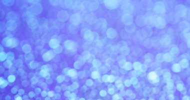 Bulanık parçacıklar. Mor toz. Işıl ışıl parlayan renkler atmosferik parlak yüzey Pastel parıltı efektiyle hassas noktalar parlıyor.