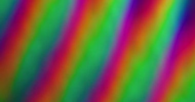 Bulanık soyut ışıltı. Renkli gökkuşağı arkaplanı. Odaksız sızıntı, yeşil ışık çizgileri, titreşimler, ışık yansımaları..