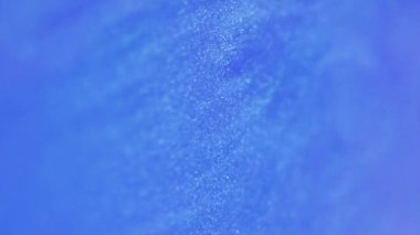 Parlak boya. Parlak arkaplan. Renkli neon emülsiyon hareketi. Güzel, ışıl ışıl, yaratıcı, hipnotik, ışıltılı bir karışım..