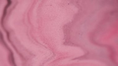 Köpüklü sıvı. Odaklanmamış sim. Boya sisi hareketi. Renkli pembe pigment kum akışı parlak doku soyut sanat hipnotik arka plan.