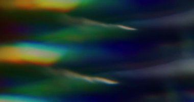 Renkli ışık efekti. Soyut parti geçmişi. Odaksız sızıntı. Sarı ışınlar. Gökkuşağı titreşimler..