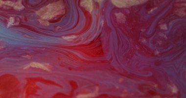 Odaklanmış sıvı. Mermer dokusunu dök. Renkli parıldayan kırmızı parlak boya akışı soyut bulanık bokeh ışık sanat arka planında hareket eden parlak parçacıklar.