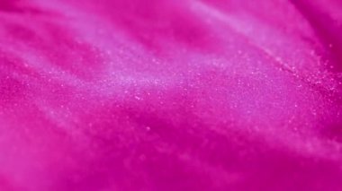 Pırıl pırıl. Bokeh ışığı. Bulanık neon morumsu pembe, parlak, pırıl pırıl parlayan mürekkep dalgalı hareket soyut sanat arka planı..