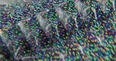 Bulanık çok renkli konfeti. Harika bir üçgen. Sarı turuncu yeşil noktalar parlayan parçalar Bokeh Işığı 'nın soyut arka planında hareket ediyor.