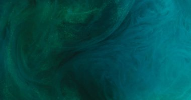 Görüntü soyut ışıl ışıl. Parlak bir parıltı. Soyut sanat arka planında mavi renkli parlayan buhar dokusu boya mürekkebi yüzen karışım döndürmesi.