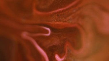 Parlak damlalar. Boya dökülmüş. Odaklanmamış altın rengi parıldayan parçacıklar sıvı emülsiyon akış hareketini soyut sanat arkaplanı.