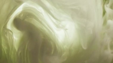 Sis dalgası. Duman girdabı. Odaklanmamış yeşil beyaz renkli parlayan sis yüzen boya, su karışımı hareket eden ruhani soyut sanat arka planı..