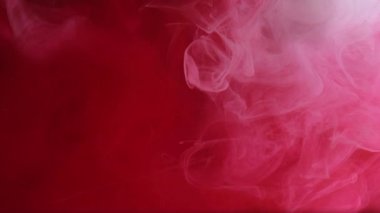 Sis bulutu. Boya dumanı. Odaklanmamış kırmızı beyaz sisli mürekkep buharı sıvı duman sıvısı soyut sanat ışığı arka planında ışıldıyor.