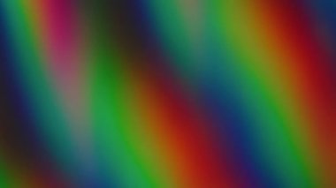 Bulanık soyut ışıltı. Renkli gökkuşağı arkaplanı. Odaksız sızıntı, yeşil ışık çizgileri, titreşimler, ışık yansımaları..