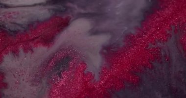Akrilik karışımı. Parıltı spreyi. Bulanık pembe gri parıldayan parçacıklar boya fırıl fırıl dönen mürekkep emülsiyonu fantezi sanat soyut arka planı..