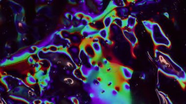 Holografik sıvı. Bulanık hareket eden parçacıklar. Odaklanamayan sızıntı, çok renkli yeşil ışınlar gökkuşağı titreşimleri, soyut sanat ışığı arka planında yanıp sönen lensler..