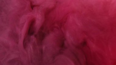 Duman peçesi. Parıltı akıyor. Kırmızı parıldayan yoğun sis kaotik bir şekilde salınır. Odaklanamayan mermer boya, köpüklü su özeti arka planda döner..