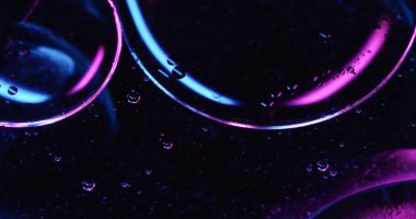 Water serum. Drop texture. Defocused blue purple neon colorful round molecular essence swirling on abstract art cosmetic background. clipart