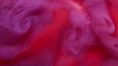 Hipnoz sıvısı. Sis dalgası. Kırmızı mor sıvı boya sarmal dumanı. Boyalı su peçesi, soyut fantezi arka planının canlı renklerini harmanlıyor.
