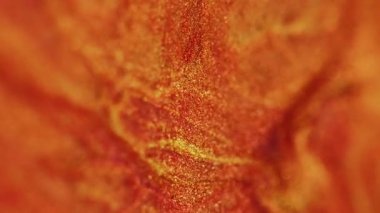 Parıltı sıçrıyor. Kaya turuncu. Altın sarısı parlak tozlar serpin soyut desenler güzel havuç parlak modern arka plan.