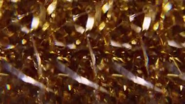Görüntü tatil sanatı. Parlak ışık. Parlayan altın sarısı çok renkli partiküller soyut arkaplanda hareket eden parlak mercek parlamaları.