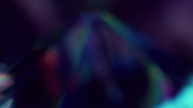 Bokeh elması. Kristal kırılma ışığı. Renkler gökkuşağı efektini değiştirir. Yerinden oynamış objektifin camları pürüzsüz bir yansımaya bakıyor. Yapay elmas kırılması.