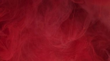 Soğuk sis. Buz ateşi alevi. Odaklanmamış kırmızı boya, parlayan ışık, yüzen bulut dokusu sıçratıyor. Soyut arkaplanda renk dumanı.