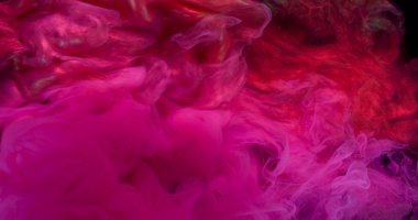 Duman dalgası. Sanat sıvısı. Pembe, kırmızı, pırıl pırıl, suda neon boya patlaması. Soyut duman sıçrama renk dökülmesi çözünmüş arkaplan.