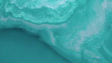 Parıldayan jel. Sihirli damla. Fantezi sıvı akışı parlayan turkuaz kum mürekkebi dalgası soyut, parlak akrilik doku çözünmüş arka plan.