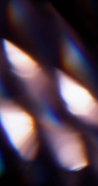 Optik işaret fişeği. Bulanık lens ışığı. Siyah arka planda odaksız mavi yeşil renkli parıltılı lazer deseni.